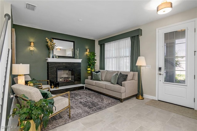 living room featuring a fireplace