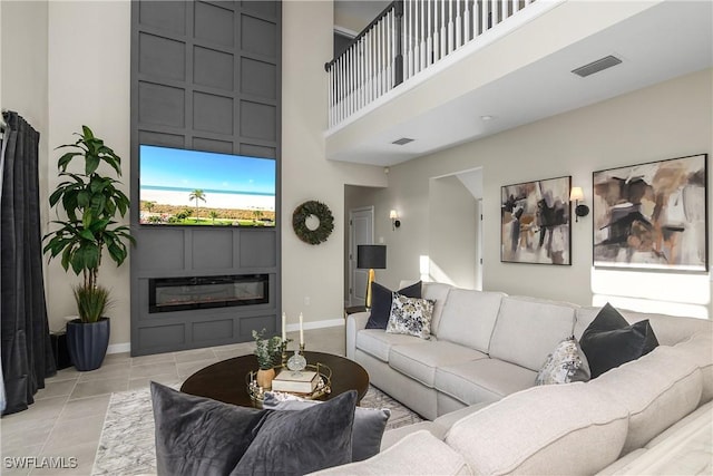 living room with a high ceiling