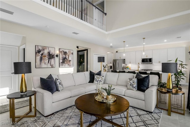 living room featuring a high ceiling