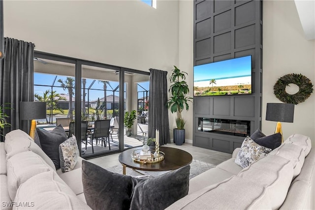 living room with a towering ceiling