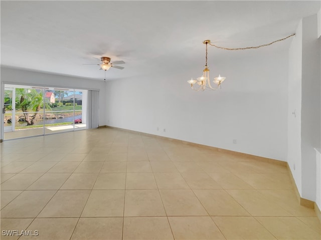 unfurnished room featuring light tile patterned floors and ceiling fan with notable chandelier