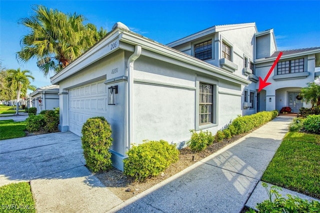 view of side of property with a garage