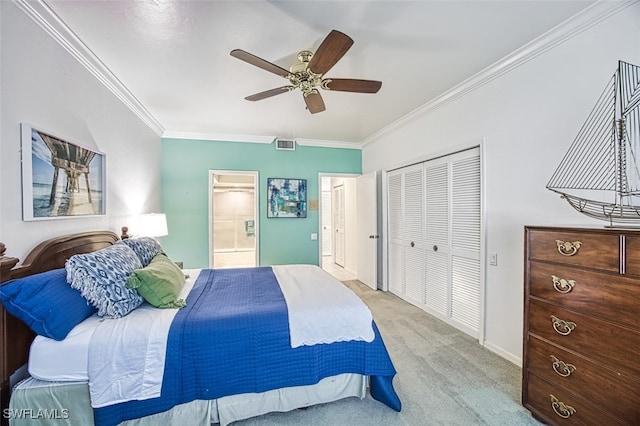 bedroom with ensuite bathroom, crown molding, light carpet, a closet, and ceiling fan