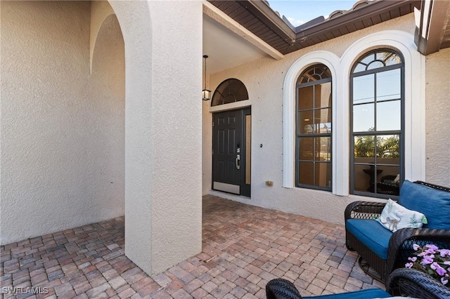 property entrance featuring a patio