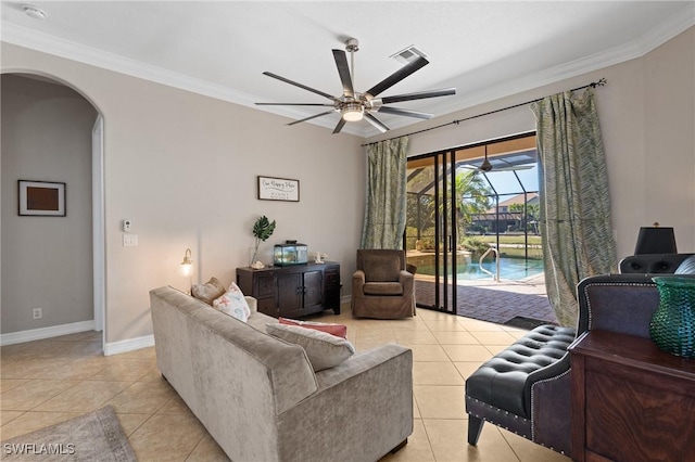 tiled living room featuring ceiling fan and crown molding