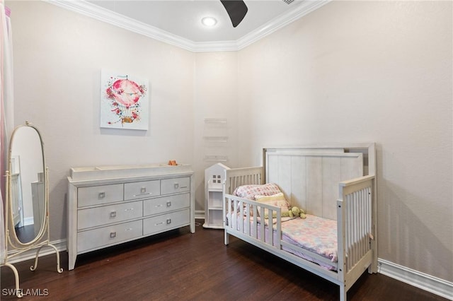 bedroom with ceiling fan, ornamental molding, and dark hardwood / wood-style floors