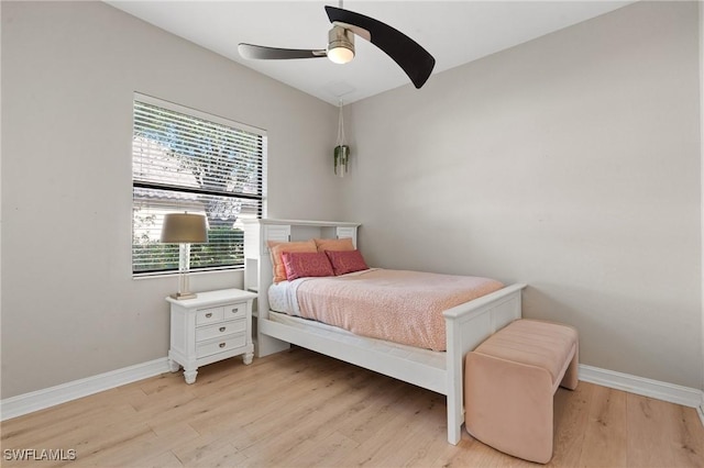 bedroom with ceiling fan and light hardwood / wood-style floors