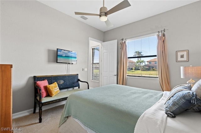 bedroom with ceiling fan and carpet floors