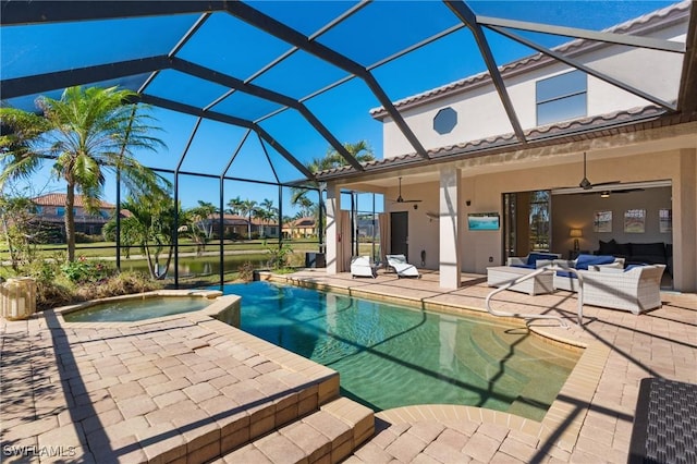 view of swimming pool featuring an in ground hot tub, an outdoor living space, ceiling fan, a lanai, and a patio area