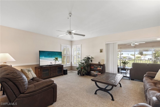 living room featuring ceiling fan and light colored carpet