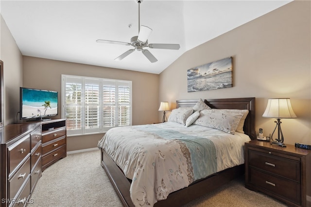 bedroom with light carpet, vaulted ceiling, and ceiling fan