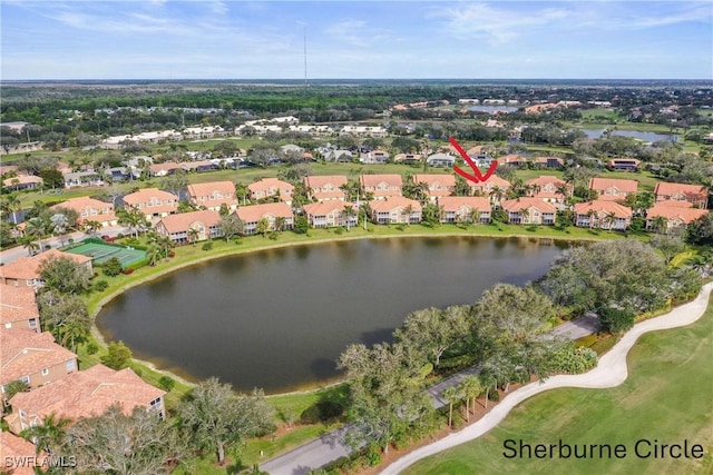 birds eye view of property with a water view