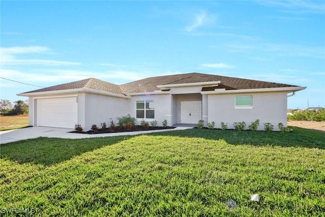 view of front of property featuring a garage and a front yard