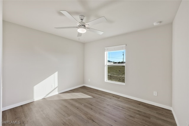 unfurnished room featuring hardwood / wood-style flooring and ceiling fan