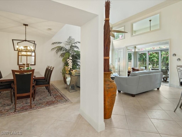 dining room featuring light tile patterned floors and a chandelier