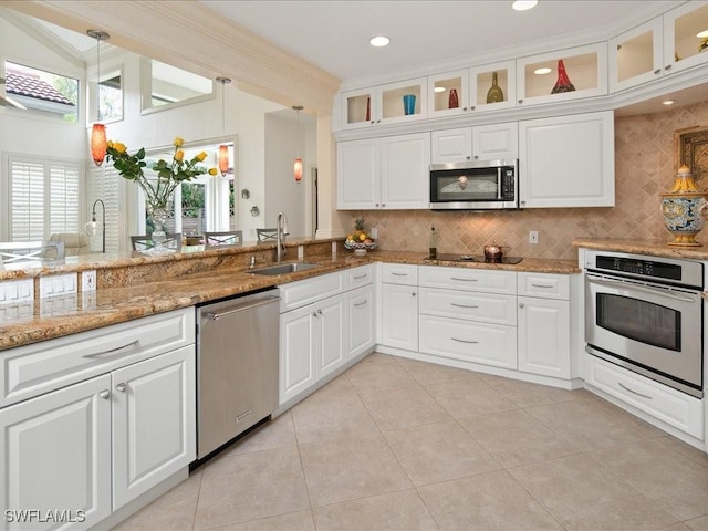 kitchen with sink, white cabinetry, and stainless steel appliances