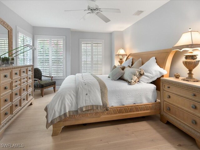 bedroom featuring light hardwood / wood-style floors and ceiling fan