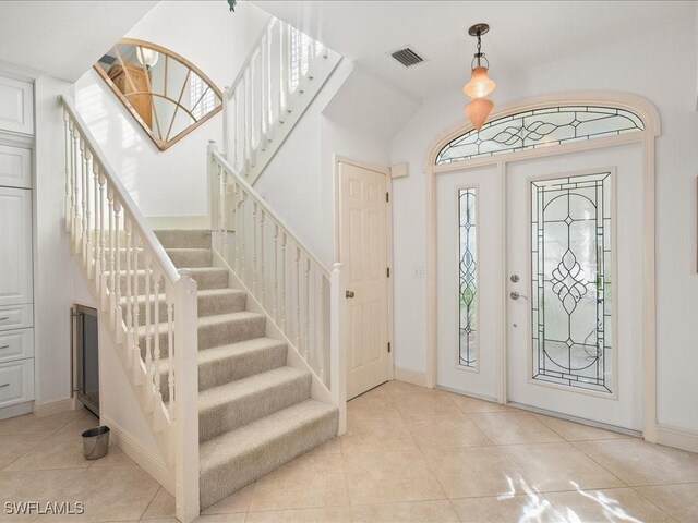 entrance foyer featuring light tile patterned floors