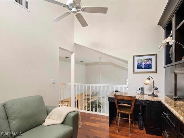 interior space with ceiling fan and dark hardwood / wood-style flooring