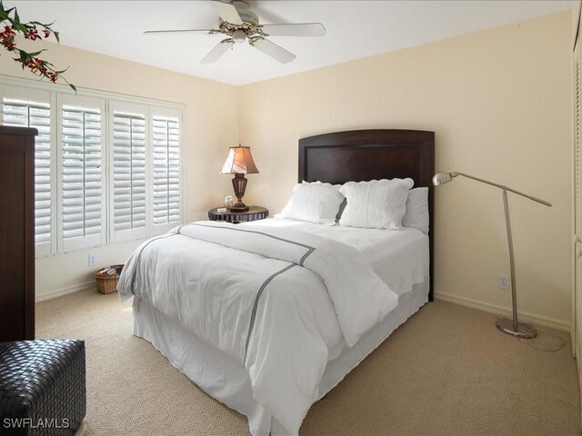 carpeted bedroom with ceiling fan