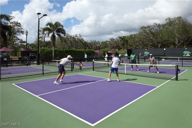 view of tennis court featuring basketball court