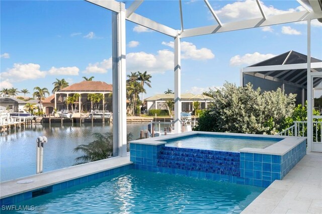 view of pool featuring a water view, glass enclosure, and an in ground hot tub