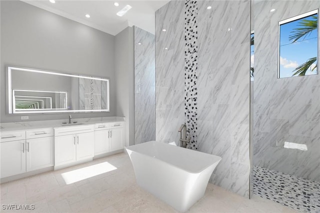 full bath with vanity, recessed lighting, a marble finish shower, and a freestanding bath