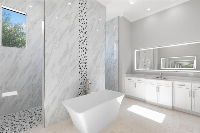 bathroom featuring a soaking tub, vanity, and a marble finish shower