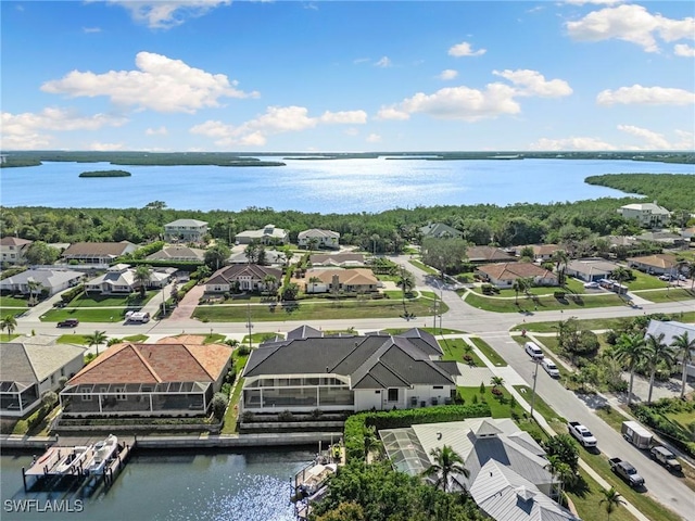 birds eye view of property with a residential view and a water view
