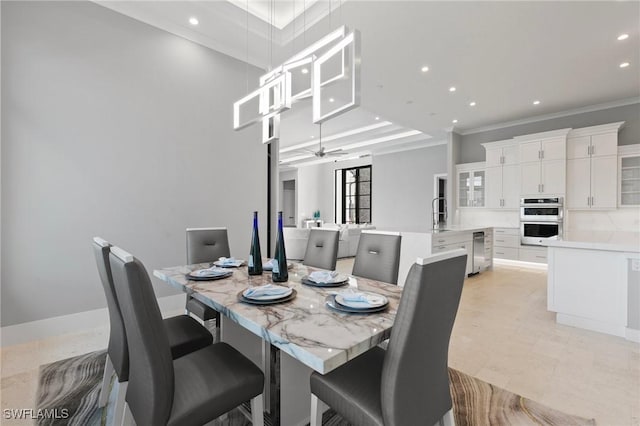 dining space with recessed lighting, baseboards, ornamental molding, and ceiling fan