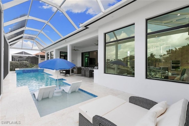 view of swimming pool featuring a ceiling fan, an outdoor living space, a patio area, and a pool with connected hot tub