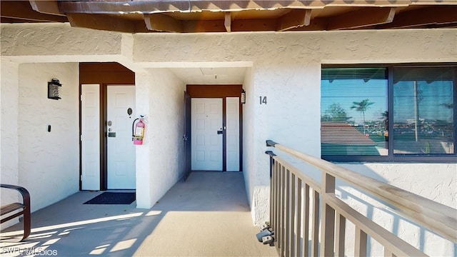 doorway to property featuring a balcony