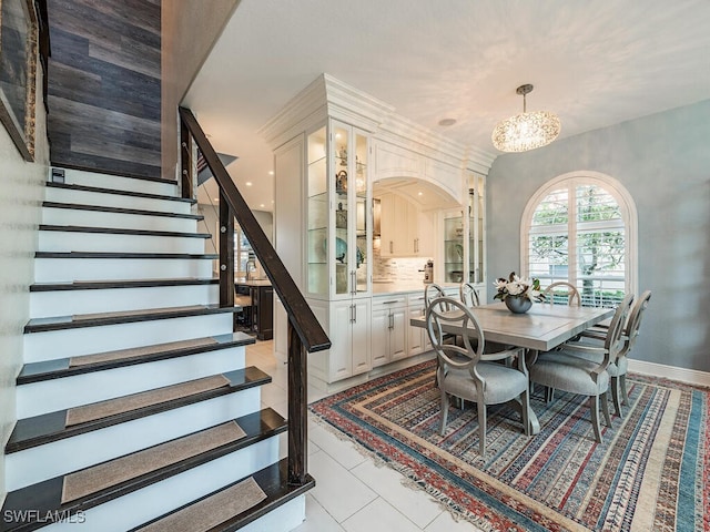 dining room featuring light tile patterned floors and an inviting chandelier