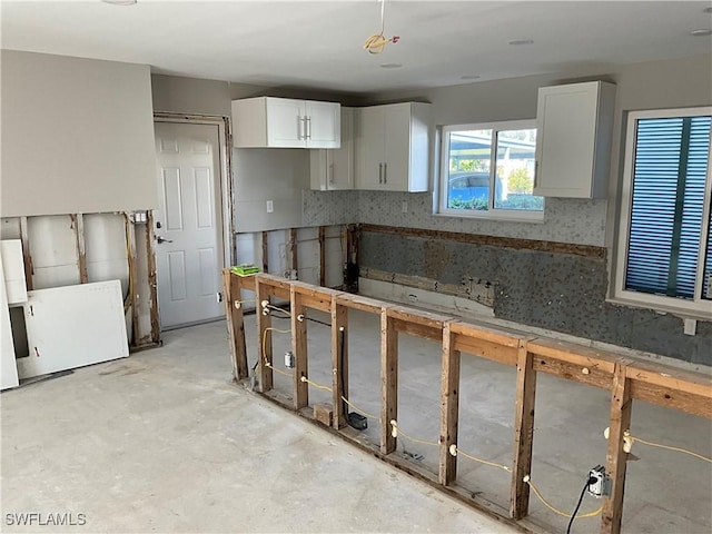 kitchen featuring white cabinets