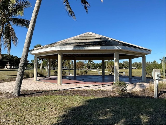 surrounding community featuring a gazebo and a lawn