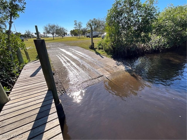 1712 Club House Rd, North Fort Myers, FL 33917 - dock area with a yard