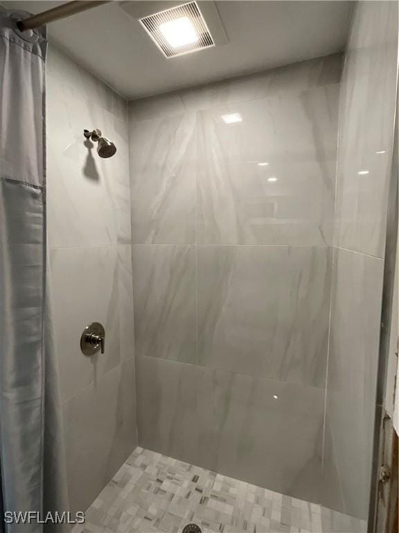 1712 Club House Rd, North Fort Myers, FL 33917 - bathroom featuring visible vents and tiled shower