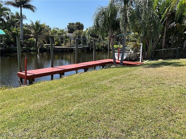 1712 Club House Rd, North Fort Myers, FL 33917 - view of dock featuring a lawn and a water view
