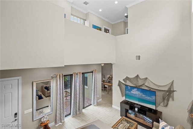 living room with ornamental molding and light tile patterned floors