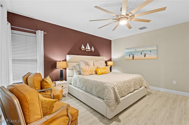 bedroom featuring ceiling fan and light hardwood / wood-style flooring