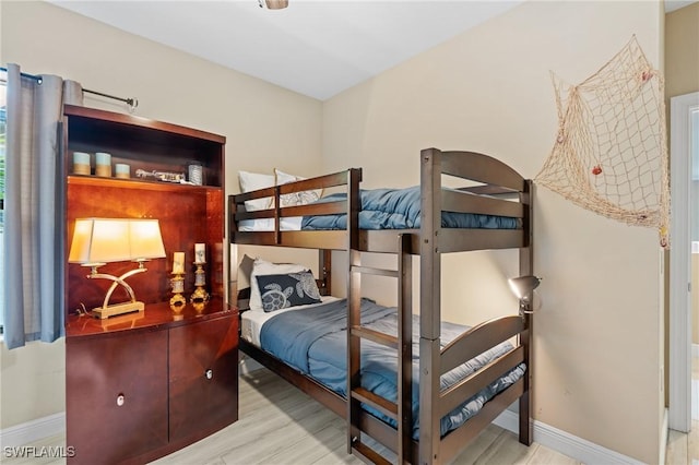 bedroom with light wood-type flooring