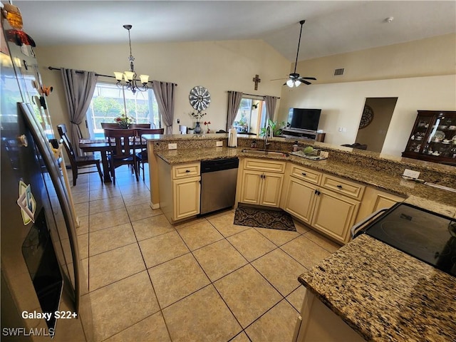 kitchen with sink, cream cabinets, stainless steel dishwasher, and stone countertops