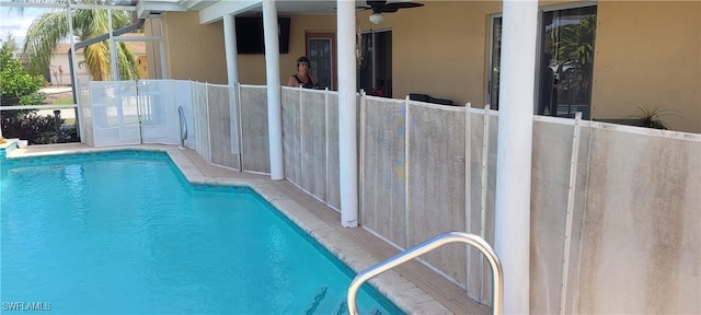 view of pool featuring ceiling fan