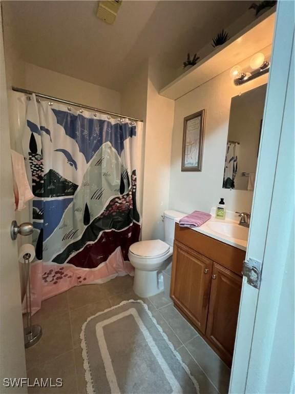 bathroom with tile patterned flooring, vanity, toilet, and a shower with shower curtain