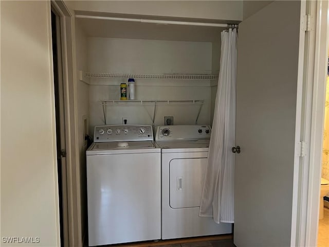 laundry room with washer and dryer