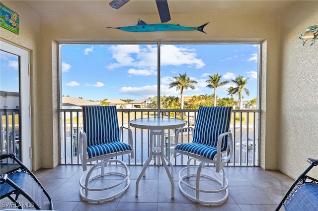 sunroom / solarium with ceiling fan