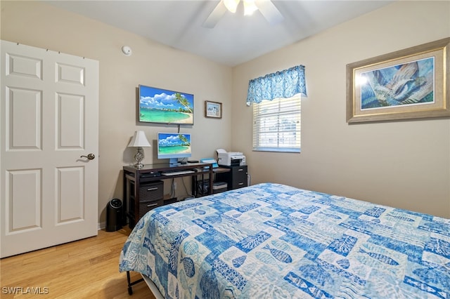 bedroom featuring light wood-type flooring and ceiling fan