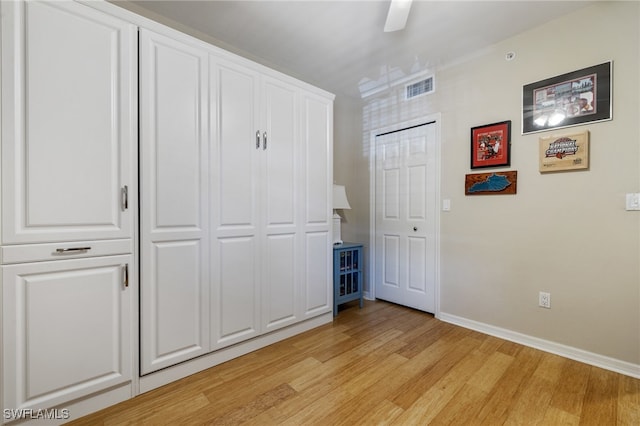 unfurnished bedroom featuring ceiling fan and light hardwood / wood-style floors