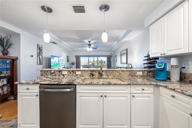 kitchen with white cabinets, sink, hanging light fixtures, stainless steel dishwasher, and ceiling fan