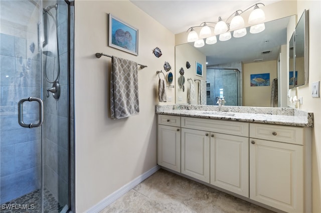 bathroom with vanity and an enclosed shower